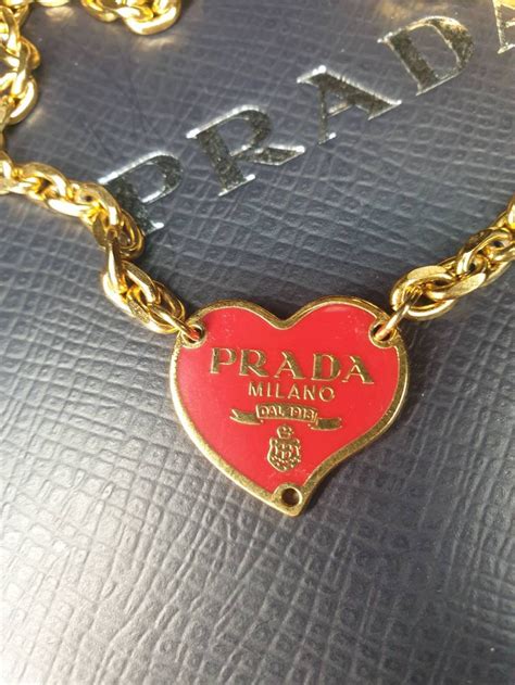 heart charm necklace burgendy prada.